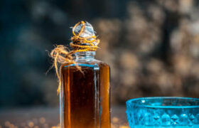 Close up of ingredients for good and smoother skin and thick and long hair is Coconut oil,mustard seeds,and mustards seed's oil.